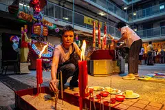 People offering prayers during the Hungry Ghost festival.