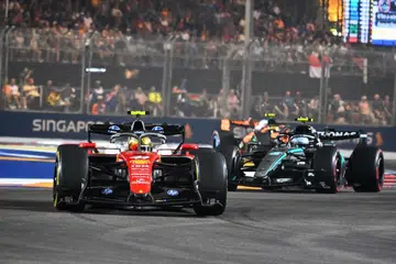 Scuderia Ferrari HP, British driver, Lewis Hamilton (left) in action during the 2026 Singapore Grand Prix at Marina Bay Street Circuit on Oct 11, 2026.