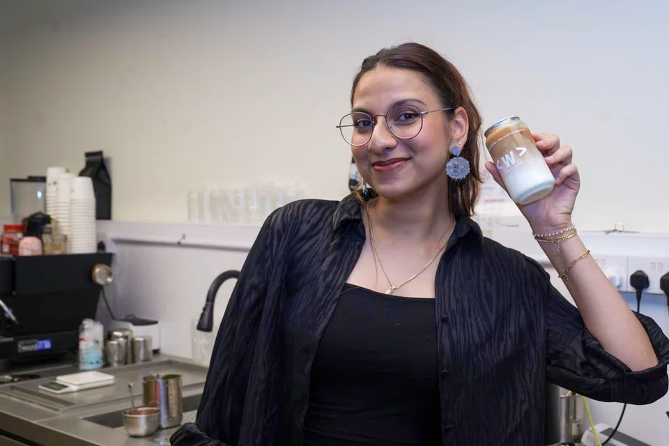 Uzma Mueez, founder of Waterloo Coffee, showcases one of her signature specialty drinks in an airtight can.