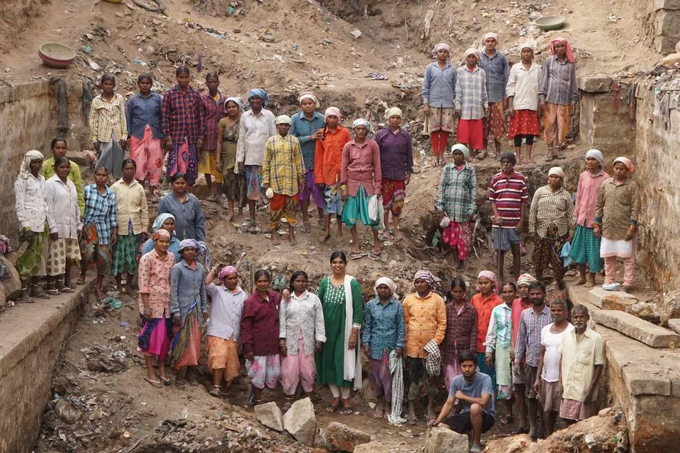 Ms Kalpana with the workers who helped clear Bansilalpet stepwell.