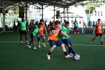HealthServe’s Futsal Friendship Cup saw migrant workers and locals playing in the same teams.