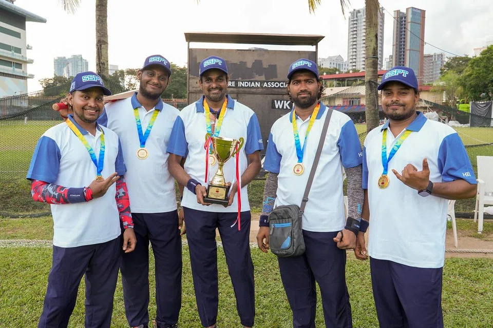 Sathiyamoorthy Venkatesan (centre) with the other priests from his Garuda Warriors team, who won the tournament.