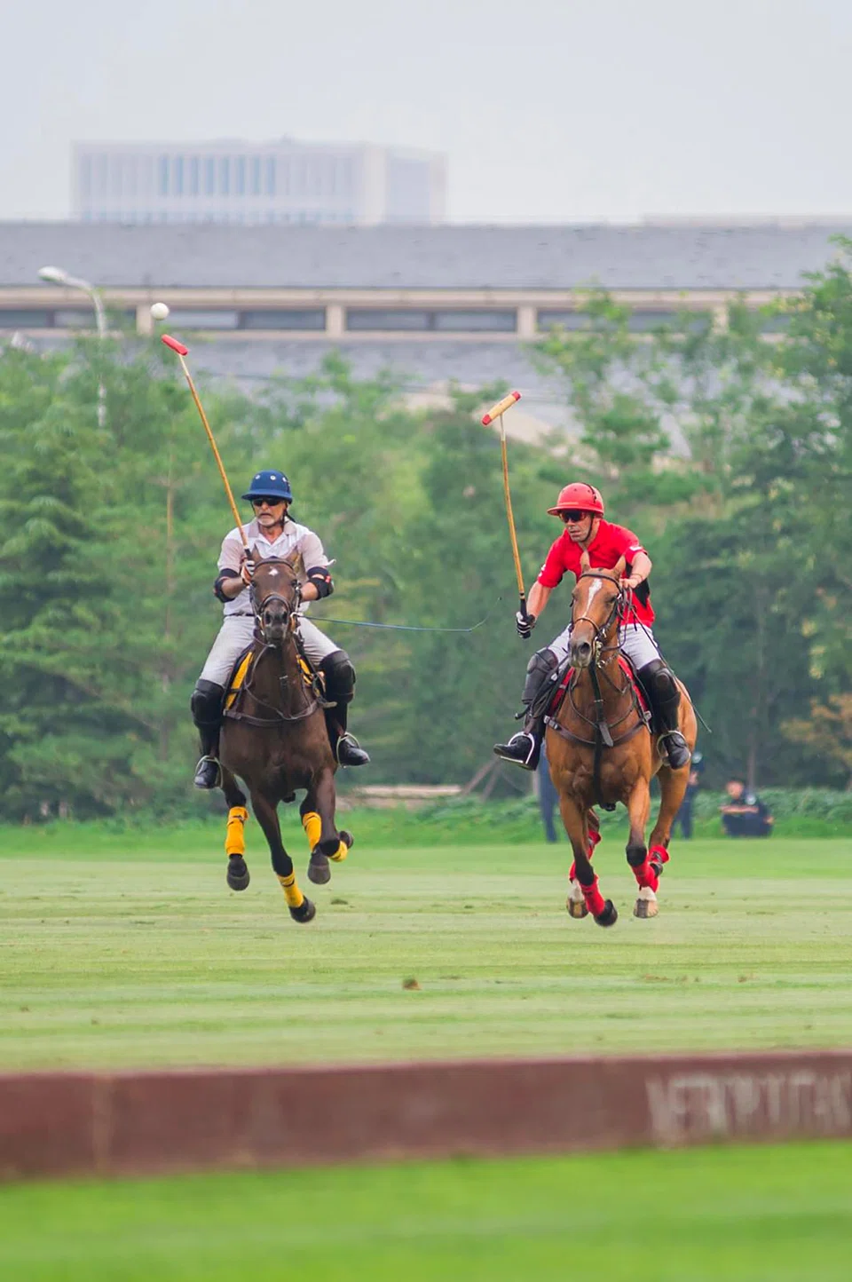 Iqbal Jumabhoy (left) in action against Argentinian player Hugo Palacios;