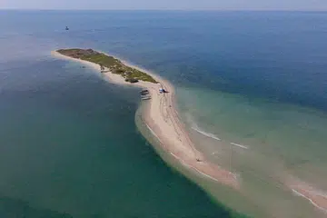 An aerial view of Kariyachalli Island, off the coast of Thoothukudi in India's Tamil Nadu state. Restoration work on Kariyachalli island hopes to rebuild its natural defences with artificial reefs, transplanted corals and seagrass meadows, in a bid to slow erosion and protect the mainland from surging seas.