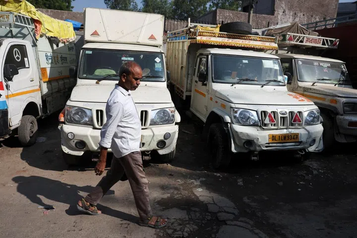 Kamta Prasad, 53, a voter who is listed as "Kanta Prasad" and is declared dead in the Special Intensive Revision (SIR) list published on August 1, 2026, goes to work, in New Delhi, India, October 19, 2026.