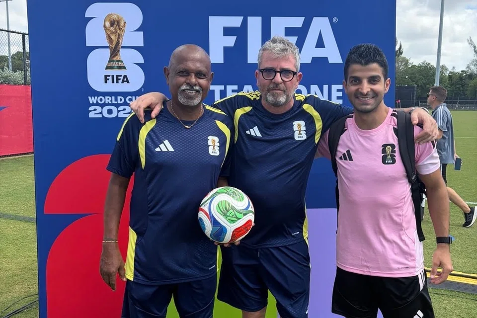 Ganesan Maniam (far left) with Roberto M (centre), head physiotherapist for the FIFA medical staff, and Abdullah Al-Shehri, video assistant referee from Saudi Arabia.