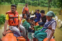 State Disaster Response Fund (SDRF) personnel rescue residents from a flooded area following heavy monsoon rains in Kalapani village, Nagaon district, Assam, India, 05 August 2026.