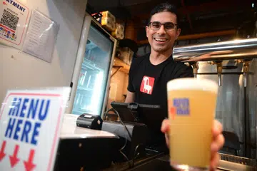 Ren Min founder Manbeer Singh at his hawker stall-cum-brewery at Maxwell Food Centre, 28 November 2024.