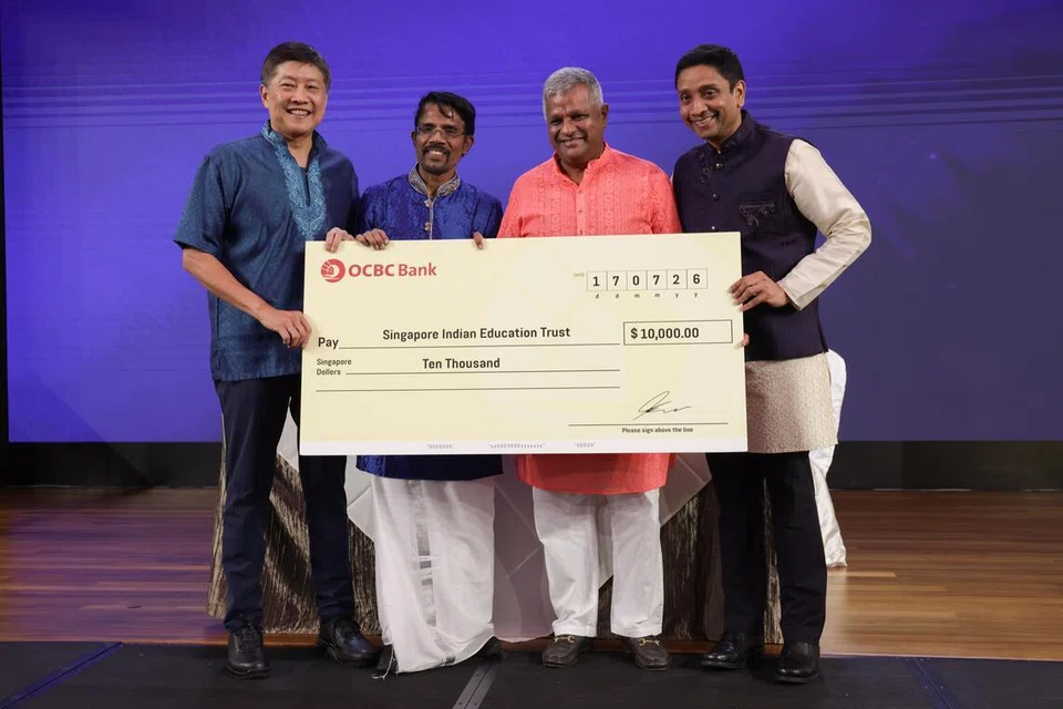 After the signing of the Memorandum of Understanding, a cheque of S$10,000 was presented by STTU to SIET. (From left to right) Secretary-General of the National Trades Union Congress Mr Ng Chee Meng, President of STTU Mr Danapal Kumar; SIET Chairman Jayaprakash Jagateesan; Mr Dinesh Vasu Dash, Minister of State for Ministry of Community, Culture and Youth, and Ministry for Manpower, and Chairman of the Tamil Promotion Committee.