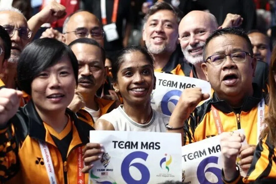 Malaysia’s Sivasangari Subramaniam (centre) celebrates with teammates after winning the Women’s Singles Gold Medal Match against India’s Anahat Singh.