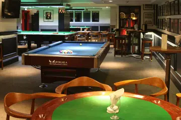 The Men’s Bar at the Singapore Cricket Club. 