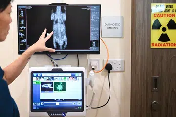 Head of Mandai Wildlife Centre, Charlene Yeong, showing an X-ray of a Sunda pangolin outside the diagnostic imaging room at the new Mandai Wildlife Centre on July 2.