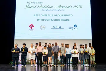Guest of Honour Senior Minister of State for Education Janil Puthucheary (centre dark blue shirt) with Best Overall Award Students and Heads of the four self-help groups including SINDA CEO Anbarasu Rajendran (in red shirt).