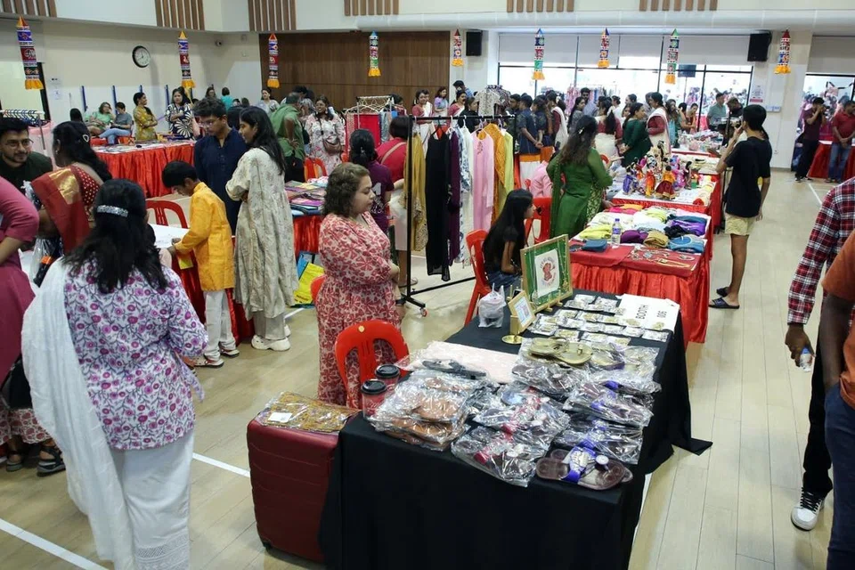 Stalls displaying Indian clothing, accessories and handicrafts.