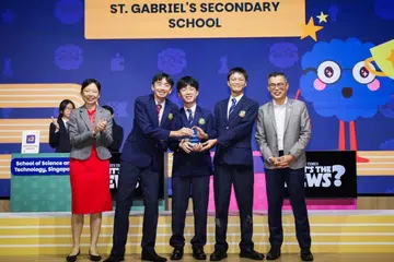Ms Jasmin Lau, Minister of State for Education and Digital Development and Information, and ST editor Jaime Ho with the winning team from St Gabriel’s Secondary School during the final round of ST’s What’s The News? quiz competition on May 26.