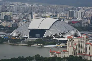 The National Stadium at The Kallang surrounded by condominiums at Tanjong Rhu and HDB flats