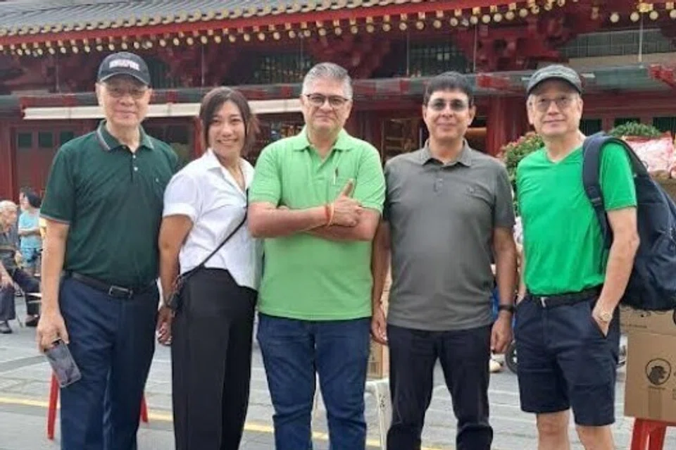 Commemorating a job well done. From left: Mr Eddie Lim, Ms Lynn Myint, Mr Mukesh Metharam (Mike), Mr Naresh Vaswani and volunteer Paul Gim Hong.