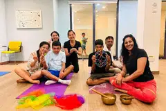 Participants alongside their caregivers during an inclusive yoga session at the Enabling Village with BlissYogaSG founder Parul Chaturvedi (right).