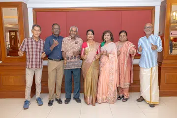 Mr Dayaram Shivnath (checked shirt) and Mr R. Thanasegaran (blue shirt) were among 8 recipients of the 2026 Excellence Award at HEB Volunteer Awards Ceremony on Aug 29.