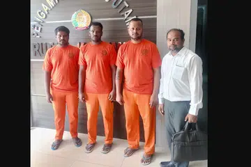 (From left) Selvadurai Dinakaran, Govindhasamy Vimalkandhan and Raju Muthukumaran with their lawyer John Paul.