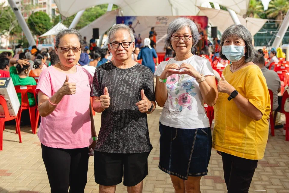 Lydia Lau and Albert Leong along with their friend group that attends community events together.