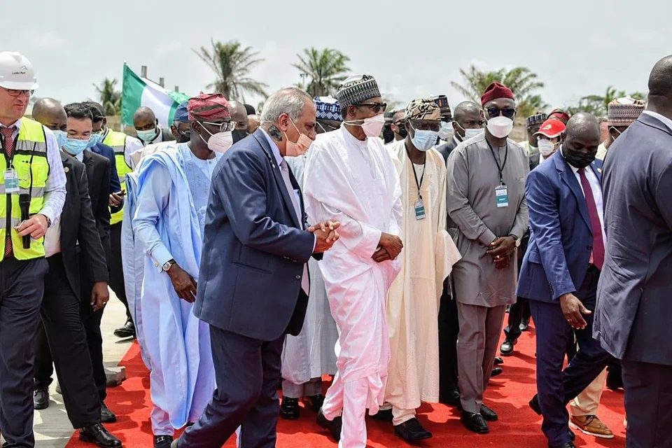 Mr Haresh Aswani with then-Nigerian Prime Minister Muhammadu Buhari during a visit to Nigeria in March 2022.
