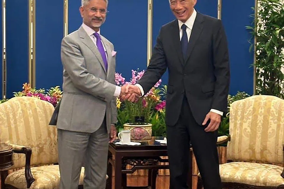 India’s External Affairs Minister S. Jaishankar and his wife Kyoko with Foreign Minister Vivian Balakrishnan and his wife Joy in Singapore last week; (below) meeting Prime Minister Lee Hsien Loong at The Istana.