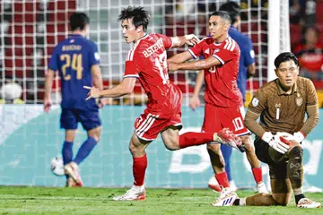 Singapore’s Harhys Stewart celebrates after scoring a goal during the second leg of the 2026 ASEAN Championship football semi-final match between Thailand and Singapore at Rajamangala National Stadium in Bangkok.