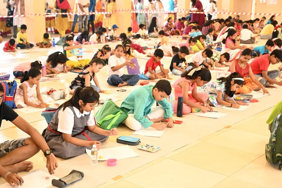 Children participating in the Raksha Bandhan art competition.