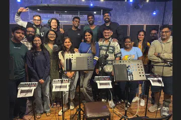 The Re-inKarnation band members, collaborators and managers at Tonehouse Studios.