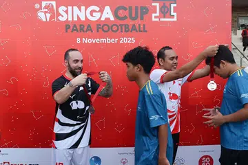 Futsal star Ricardinho giving out medals to the players who featured in the friendly para match.