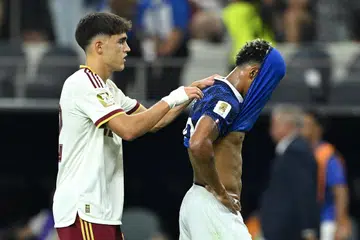Desire Doue of France is consoled by Pau Cubarsi of Spain after the team's 0-2 defeat in the FIFA World Cup 2026 Semi Final match