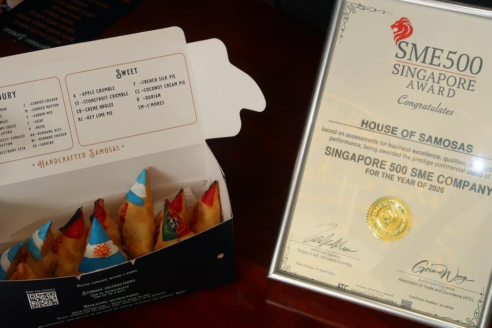 House of Samosas’ Match Night Munchies Box with football-themed samosas and the SME 500 Award plaque.