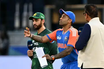 India's captain Suryakumar Yadav (right) did not shake hands with his Pakistan counterpart Salman Agha after the toss during their league match at the Dubai International Stadium on Sept 14. 