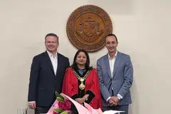 Sandy Reddy (centre) is a first generation migrant from India