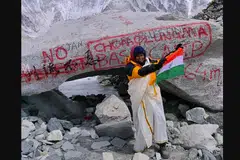 Ms Vasanthy Cheruveettil at Everest Base Camp dressed in traditional Kerala attire.