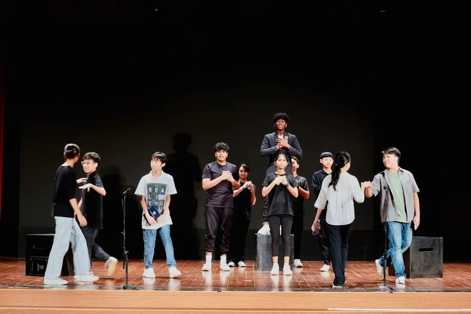 A scene from the play performed by Woodlands Secondary School