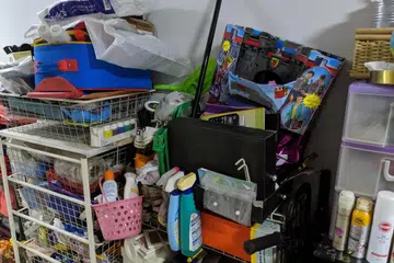 A resident's clutter outside a unit at Block 13 Cantonment Close.
