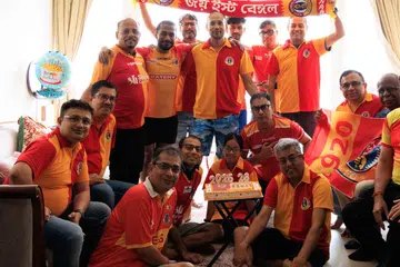 East Bengal supporters Aurobindo, Aniket, Anirban, Atanu, Jit, Amritava, Arghya, Shubajit, Avra, Shamik, Avish, Asish, Ani, Devroop, Auli and Kishaloya celebrating in the club’s colours on May 27 in Bayshore.