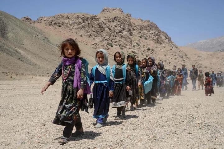 Afghan children leave after attending a primary school in Khvajeh Atis village in southern Afghanistan's Zabul province earlier in 2026.
