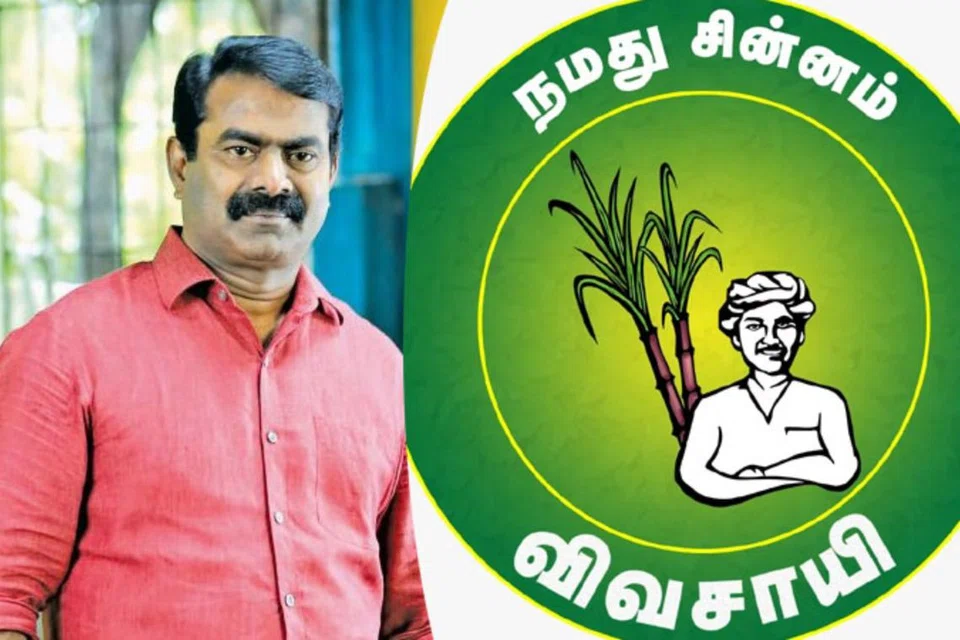 தனது சின்னத்துடன் சீமான்.