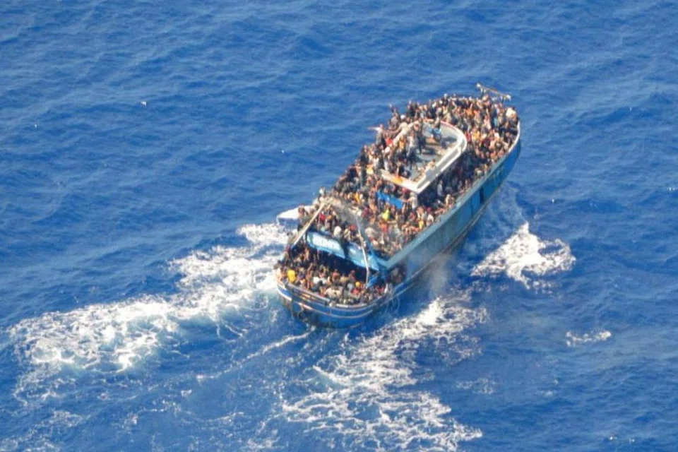 FILE PHOTO: A undated handout photo provided by the Hellenic Coast Guard shows migrants onboard a boat during a rescue operation, before their boat capsized on the open sea, off Greece, June 14, 2023. Hellenic Coast Guard/Handout via REUTERS