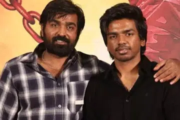 மகன் சூர்யாவுடன் விஜய் சேதுபதி.