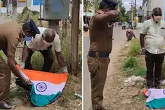 தேசியப் பறவை என்பதால் இறந்த அந்த பெண் மயிலுக்கு தேசியக்கொடியைப் போர்த்தி  காவல் துறையினர் உரிய மரியாதை செலுத்தினர்.  படம்: தமிழக ஊடகம்