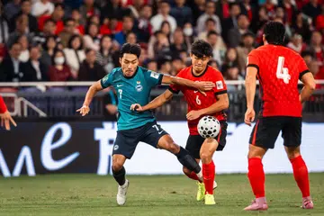 ஹாங்காங்கின் கை தாக் விளையாட்டரங்கில் ஹாங்காங் அணியைத் தோற்கடித்த சிங்கப்பூர் அணி. 