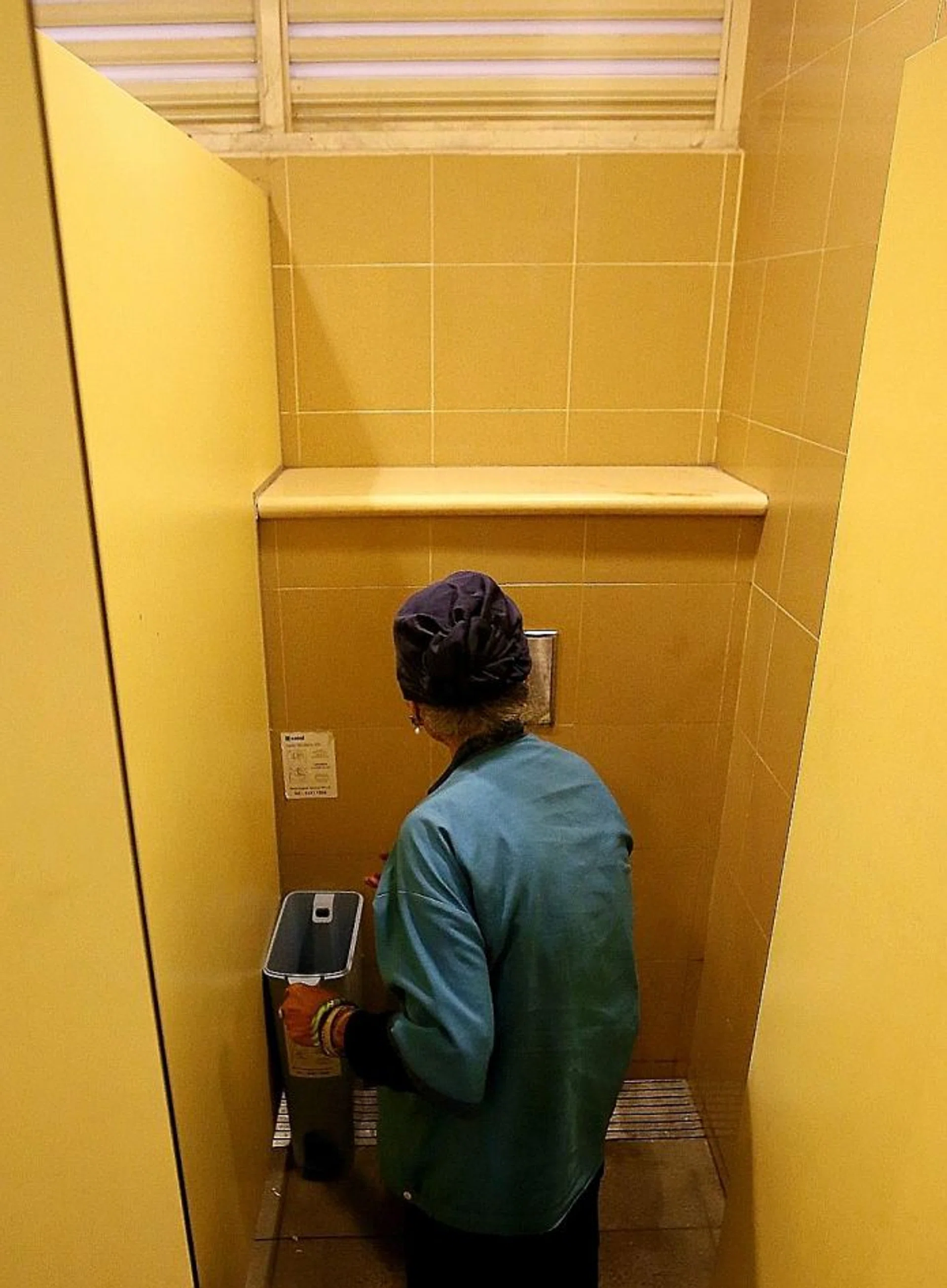 LOCATION: Madam Jumiati Amat showing the toilet and sanitary pad bin where she found the dead baby. 