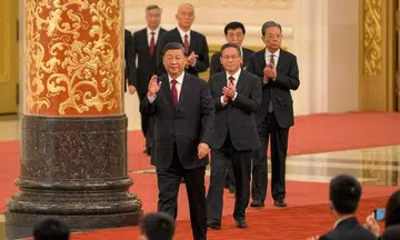 China's Xi takes helm for third term, unveils new leadership team stacked with allies