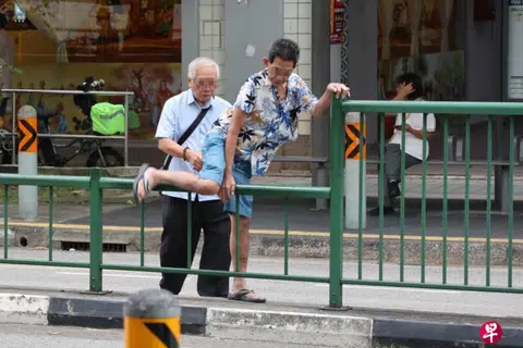 Elderly pedestrians climb railings, jaywalk to betting centre; onlookers call it 'dangerous'