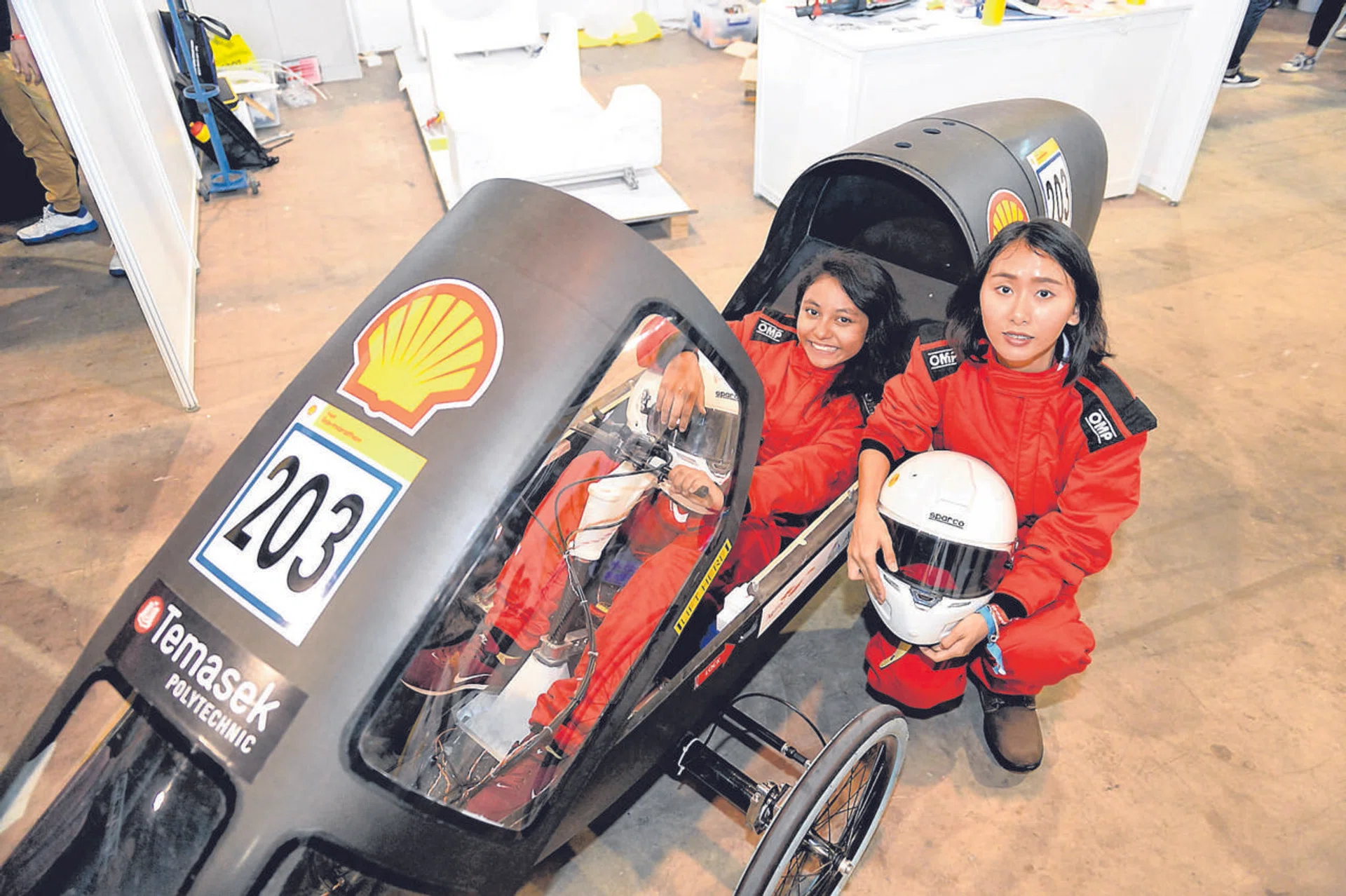 Ms Shazreen Ramli (left) and Ms Lin Lin will be driving Temasek Polytechnic's car, which runs on a hydrogen fuel cell. 