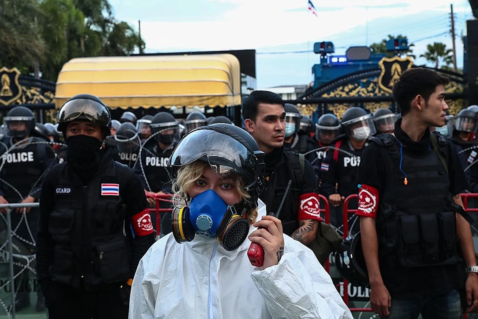 A pro-democracy protester in Bangkok outside the 11th Infantry Regiment, one of two units that were moved under the King's command last year. 